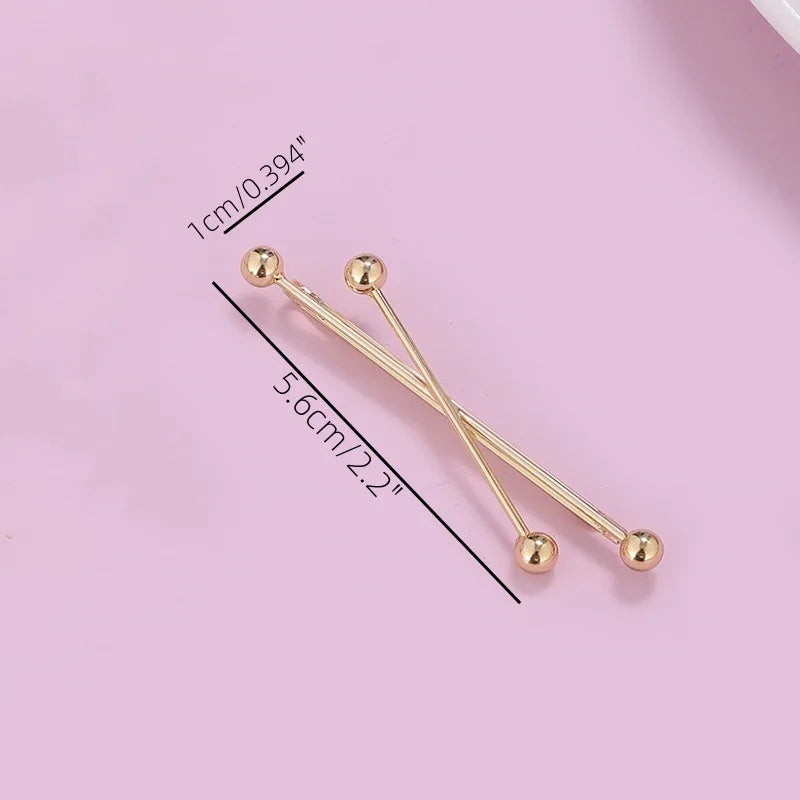 Gold pearl cross hair clips and hair barrettes