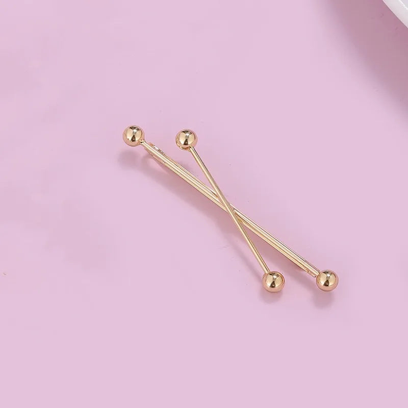 Gold pearl cross hair clips and hair barrettes